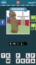 Large brown head statue on the grass.|Country|icomania answer
